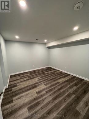Guelph (Pineridge/Westminster Woods) apartment for rent - A room with wooden flooring and white walls.