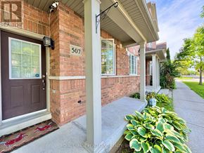 Markham (Cornell) townhouse for rent - A house numbered 507 with a red door and a porch.