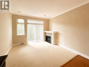Vancouver apartment for rent - A living room with a fireplace and a window with blinds.
