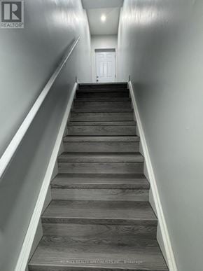 Brampton (Bram East) apartment for rent - A set of stairs leading to a white door.
