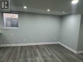 Brampton (Bram East) apartment for rent - A room with a window and wooden flooring.