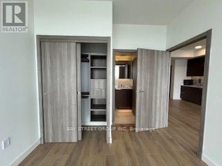 Toronto (Bayview Village) condo for rent - A realtor's office showcases a modern kitchen and living room.