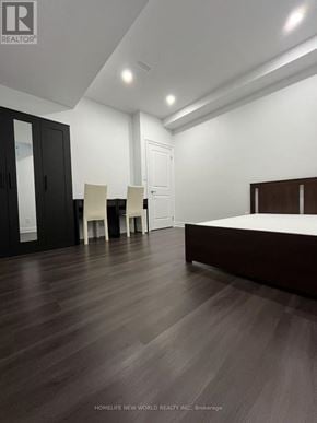 Markham (Cornell) apartment for rent - A bedroom with a bed, chair, and wardrobe.