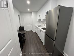 Markham (Cornell) apartment for rent - A kitchen with a refrigerator, sink, and cabinets.
