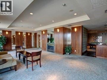 Toronto (Church-Yonge Corridor) condo for rent - A living room with a pool table and a fireplace.