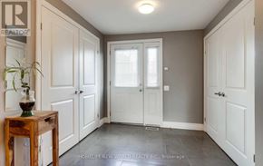 Georgina (Keswick South) apartment for rent - A hallway with a wooden table and a potted plant.