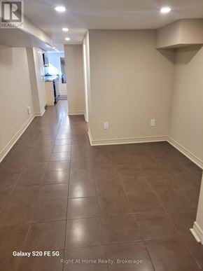 Toronto (Corso Italia-Davenport) triplex for rent - A hallway with Galaxy S20FE 5G phone in the corner.