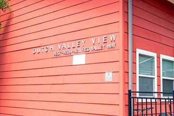 Knoxville apartment for rent - A red building with a sign that says Dutch Valley View.