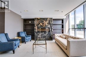 Burlington (Uptown) condo for rent - A living room with a fireplace and blue chairs.