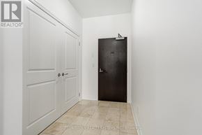 Toronto (Bayview Village) condo for rent - A hallway with a black door and a white door.