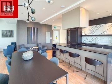 North Vancouver apartment for rent - A modern dining room with a wooden table and chairs.