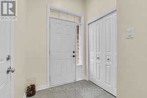 Ottawa townhouse for rent - A white door with a glass window is in a room with a white wall.