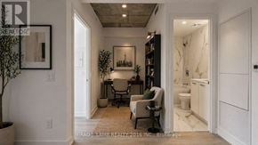 Toronto (Moss Park) condo for rent - A room with a chair and a table in it.
