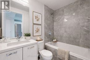 Toronto (Moss Park) condo for rent - A bathroom with a toilet, sink, and bathtub.