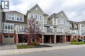 Cambridge townhouse for rent - A large, multi-story residential building with a tree in front.