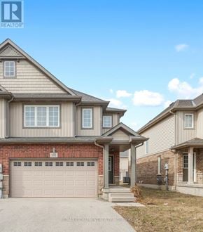 Thorold (Confederation Heights) townhouse for rent - A realtor photo of a house with a garage.