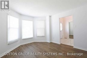 Mississauga (Lisgar) apartment for rent - A room with a white wall and a door on the right side.