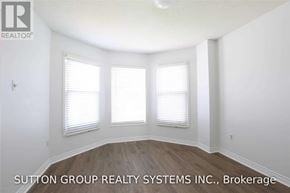 Mississauga (Lisgar) apartment for rent - A room with a window and a logo of a realtor.