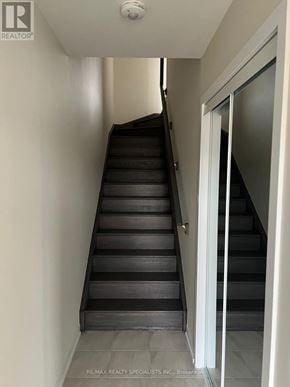 Thorold (Hurricane/Merrittville) townhouse for rent - A staircase with a glass door at the top.