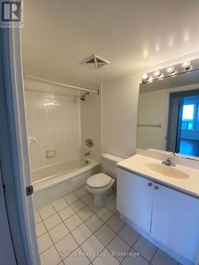 Mississauga (Cooksville) condo for rent - A white bathroom with a toilet, sink, and bathtub.