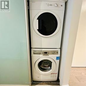 Toronto (Waterfront Communities) condo for rent - A white dryer and washer are stacked on top of each other.