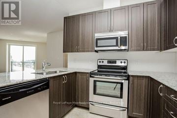 Milton (Sc Scott) condo for rent - A kitchen with a stove top oven and microwave above it.