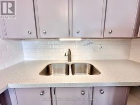 St. Catharines (Glendale/Glenridge) condo for rent - A kitchen with a sink and a countertop.
