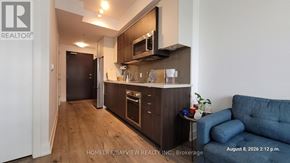 Toronto (Willowdale East) condo for rent - A well-lit kitchen area with wooden flooring and modern appliances.
