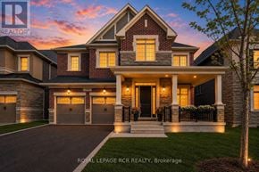 Vaughan (Kleinburg) apartment for rent - A house with a large front yard and a garage.