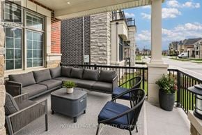 Vaughan (Kleinburg) apartment for rent - A patio with a sofa, chairs, and a table.