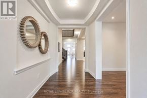 Vaughan (Kleinburg) apartment for rent - A hallway with a wooden floor and white walls.