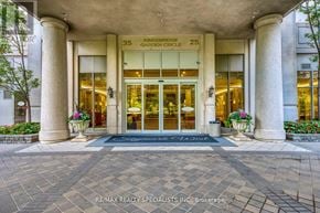 Mississauga (Hurontario) condo for rent - The front of a building with a sign that reads "Kensington Garden Circle".