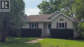 Nanticoke apartment for rent - A house with a brown roof and a sign that says REALTOR.