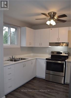 London North (North F) townhouse for rent - A kitchen with white cabinets and a stainless steel oven.