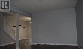 London North (North F) townhouse for rent - A realtor's office with a staircase leading to the upper floor.