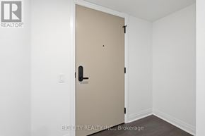 Toronto (Thorncliffe Park) condo for rent - A white door with a black handle is in a room with white walls.