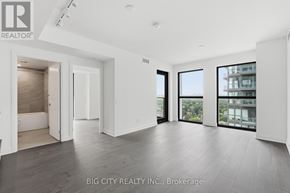 Toronto (Thorncliffe Park) condo for rent - A spacious, well-lit room with a view of the cityscape through large windows.