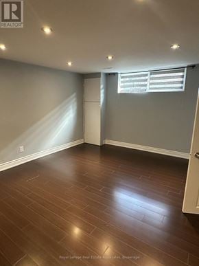 Mississauga (Dixie) apartment for rent - A room with wooden flooring and a window with blinds.