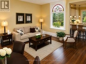 London South (South F) apartment for rent - A living room with a couch, two chairs, a coffee table, and a dining table with a view of the backyard.