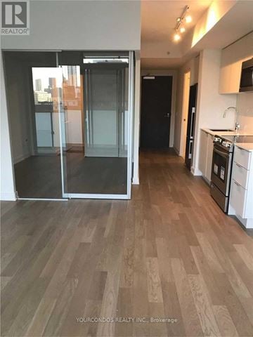 Toronto (Church-Yonge Corridor) condo for rent - A kitchen with a refrigerator, oven, and sink.