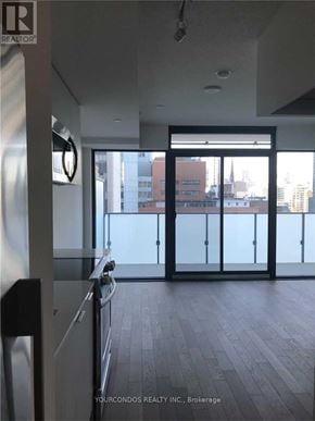Toronto (Church-Yonge Corridor) condo for rent - A room with a view of the city through large windows.