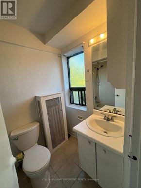Toronto (Blake-Jones) condo for rent - A white toilet sits next to a white sink in a small bathroom.