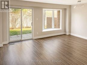 Mississauga (Applewood) townhouse for rent - A room with a sliding glass door leading to a backyard.
