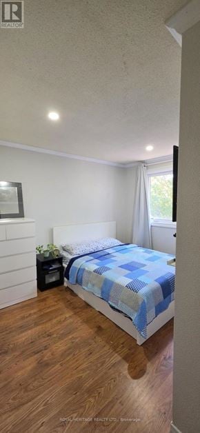 Mississauga (Streetsville) townhouse for rent - A bedroom with a bed and a nightstand.