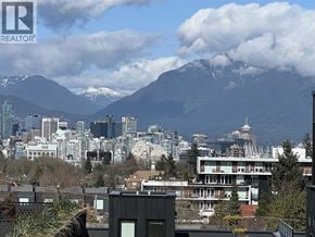 Vancouver townhouse for rent - A cityscape with a mountain in the background and a building in the foreground.