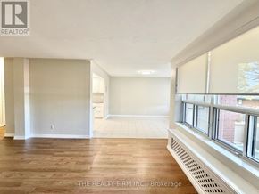 London South (South F) condo for rent - A room with wooden floors and white walls, with a window on the right side.