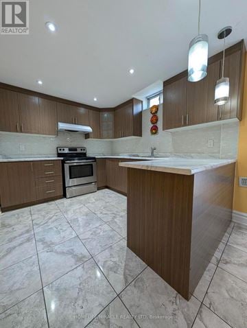 Caledon apartment for rent - A kitchen with a marble floor and wooden cabinets.