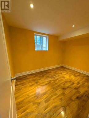 Caledon apartment for rent - A room with wooden flooring and a window.
