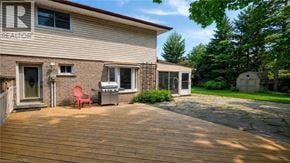 Guelph apartment for rent - A house with a wooden deck and a grill.