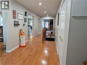 Hamilton apartment for rent - A hallway with wood floors and white walls.